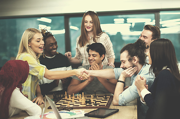 Image showing multiethnic group of business people playing chess