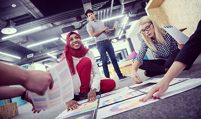 Image showing black muslim woman having meeting with Multiethnic  startup busi