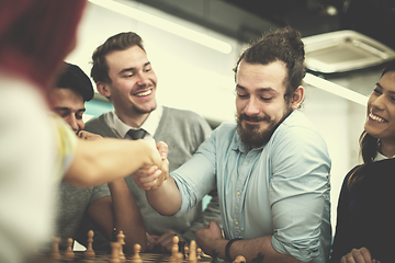 Image showing multiethnic group of business people playing chess