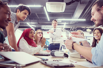 Image showing multiethnic business team learning about drone technology