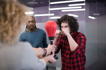 Image showing multiethnics business team boxing at office