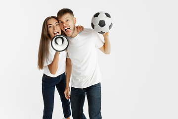 Image showing Portrait of beautiful couple football fans on white studio background