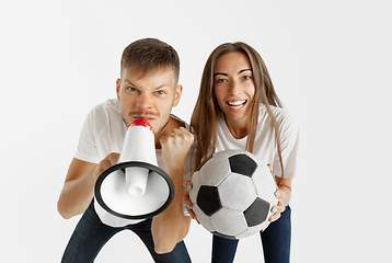 Image showing Portrait of beautiful couple football fans on white studio background