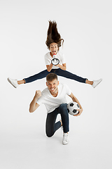 Image showing Portrait of beautiful couple football fans on white studio background