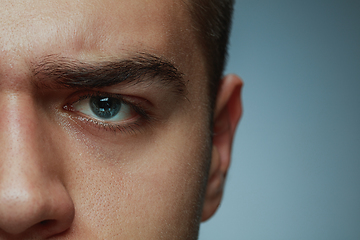 Image showing Close-up portrait of young man isolated on grey studio background