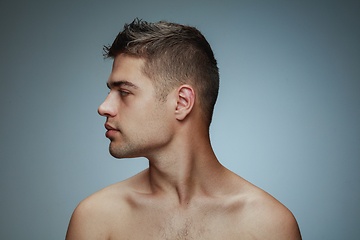 Image showing Portrait of shirtless young man isolated on grey studio background