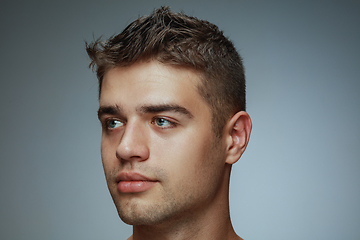 Image showing Portrait of shirtless young man isolated on grey studio background