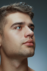 Image showing Portrait of shirtless young man isolated on grey studio background