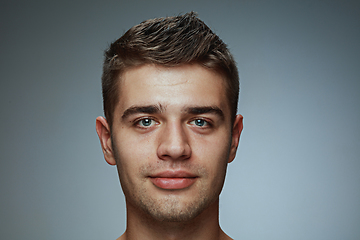 Image showing Portrait of shirtless young man isolated on grey studio background