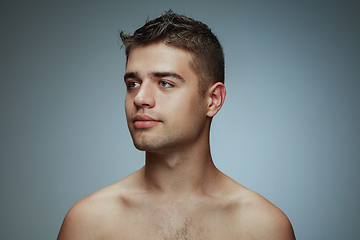 Image showing Portrait of shirtless young man isolated on grey studio background