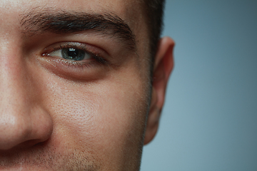 Image showing Close-up portrait of young man isolated on grey studio background