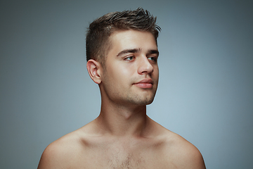 Image showing Portrait of shirtless young man isolated on grey studio background