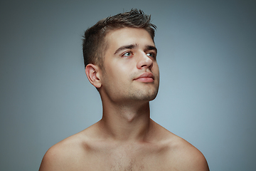 Image showing Portrait of shirtless young man isolated on grey studio background