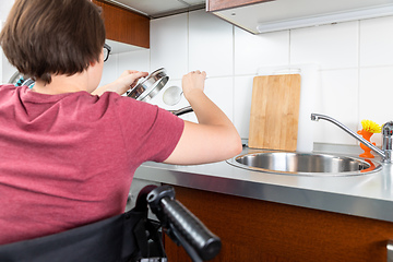 Image showing disabled woman cooking in the kitchen