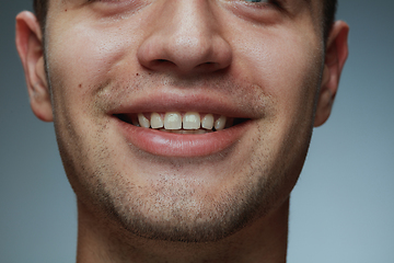 Image showing Close-up portrait of young man isolated on grey studio background