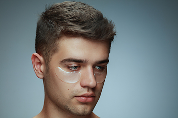 Image showing Close-up portrait of young man isolated on grey studio background