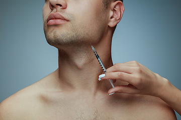 Image showing Close-up portrait of young man isolated on grey studio background