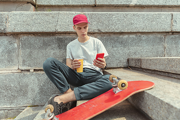 Image showing Skateboarder at the city\'s street in sunny day