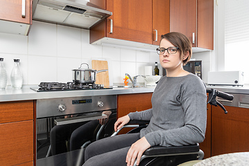 Image showing disabled woman cooking in the kitchen
