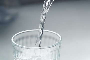 Image showing pour a glass of water