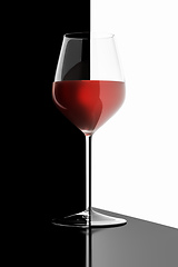 Image showing glass of red wine black and white reflections