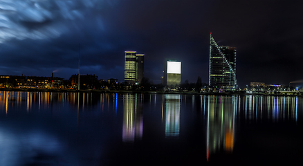 Image showing Riga skyline with skyscrapers and water reflections