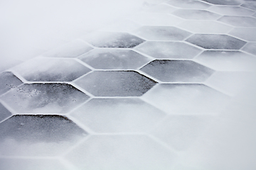 Image showing Hexagonal tiles covered with snow