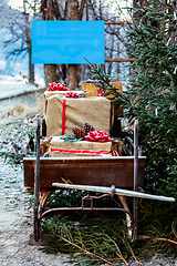 Image showing Wooden sledge from the front with presents