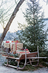 Image showing Wooden sledge on the side with presents