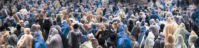 Image showing Crowd in colorful raincoats