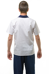 Image showing A man in a medical shirt and pants, a view from the back