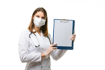 Image showing Girl vrech holds a tablet in her hands with a blank sheet of paper