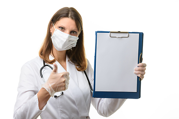 Image showing Doctor showing a tablet with a blank sheet of paper and thumb up