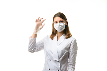 Image showing Portrait of a pharmacologist laboratory assistant with a test tube in his hands with white powder