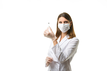 Image showing Laboratory technician holds a test tube with medicine