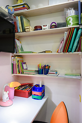 Image showing Writing desk in the children\'s room, view of the shelves for school books