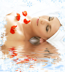 Image showing red petals spa with water