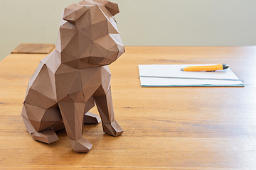 Image showing Dog in polygon cubist style on the table.