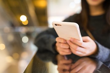 Image showing Woman working on cellphone