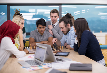 Image showing multiethnic group of business people playing chess