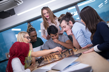 Image showing multiethnic group of business people playing chess