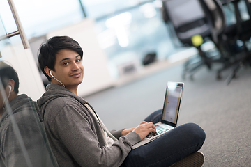 Image showing software developer working on the floor