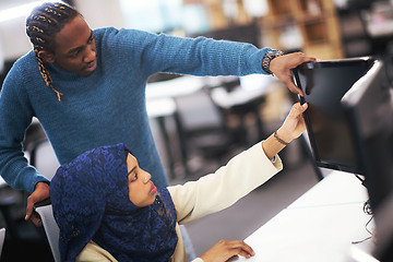 Image showing young black muslim female software developer at work