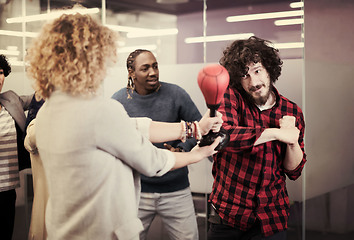 Image showing multiethnics business team boxing at office