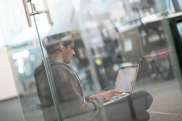 Image showing software developer working on the floor