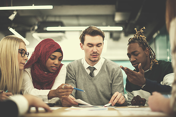 Image showing Multiethnic startup business team having meeting