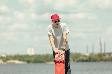 Image showing Skateboarder at the city\'s street in sunny day