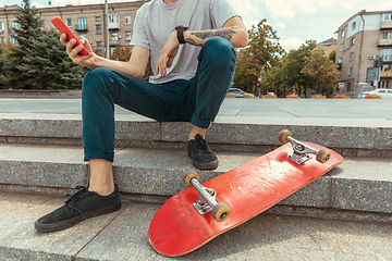 Image showing Skateboarder at the city\'s street in sunny day