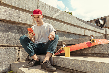 Image showing Skateboarder at the city\'s street in sunny day