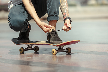 Image showing Skateboarder at the city\'s street in sunny day